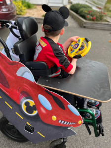 Mickey racecar costume for child in wheelchair